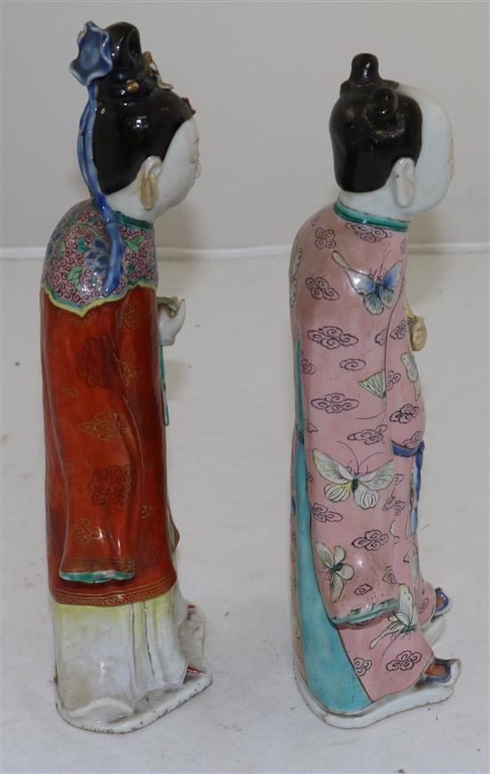 Two Chinese famille rose enamelled figures of female immortals, late 18th century, 26 and 24.5cm, losses and restoration